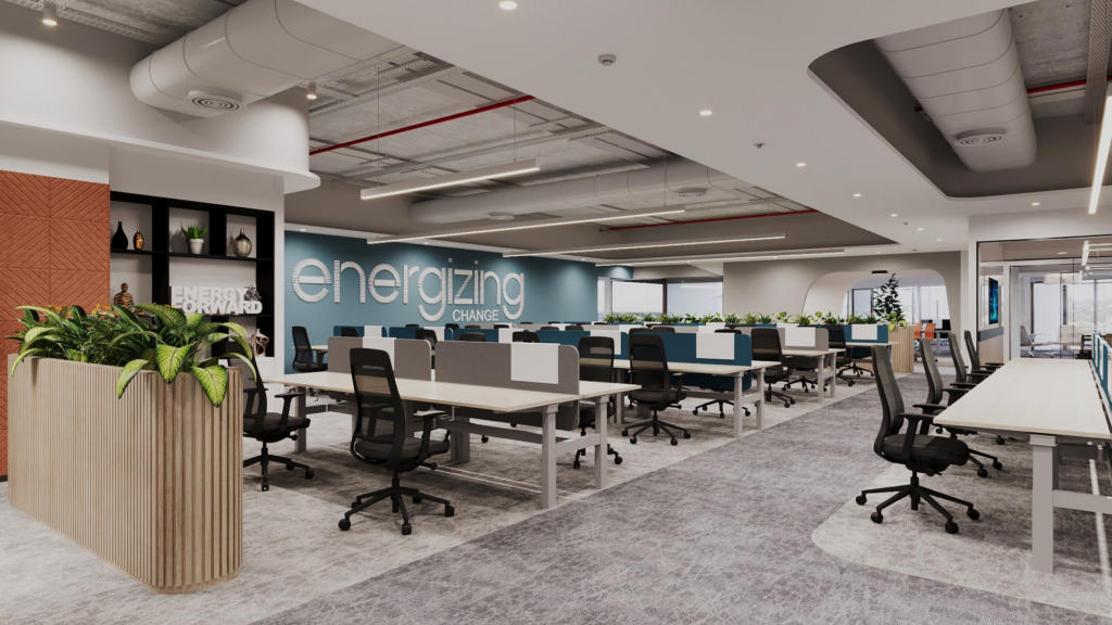 Open workfloor: energizing change brand text on teal wall, sit-stand benching clusters, curved acoustic ceiling baffles, geometric carpet, wood-slatted planter at entry.