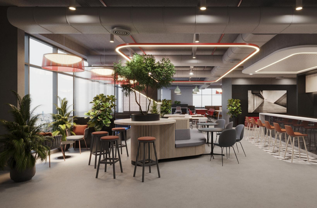 Café and breakout: circular red-edged ceiling halo in brand colour, large central planter with tree, casual high tables and counter stools, motorcycle mural on back wall.